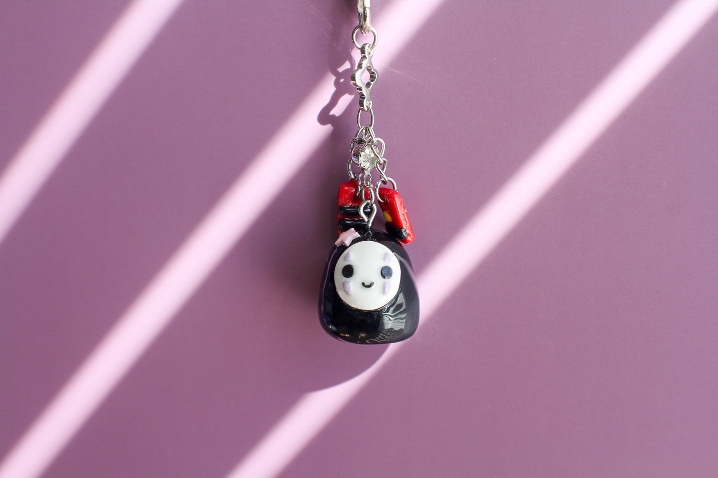 NO-FACE WITH MONEY KEYCHAIN