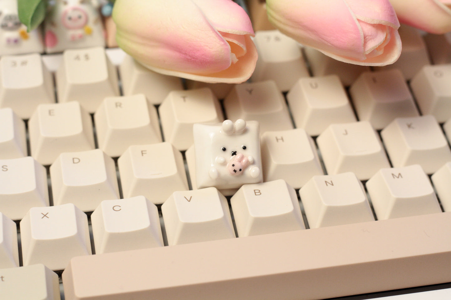 Miffy bunny holding a tiny doll version of miffy.