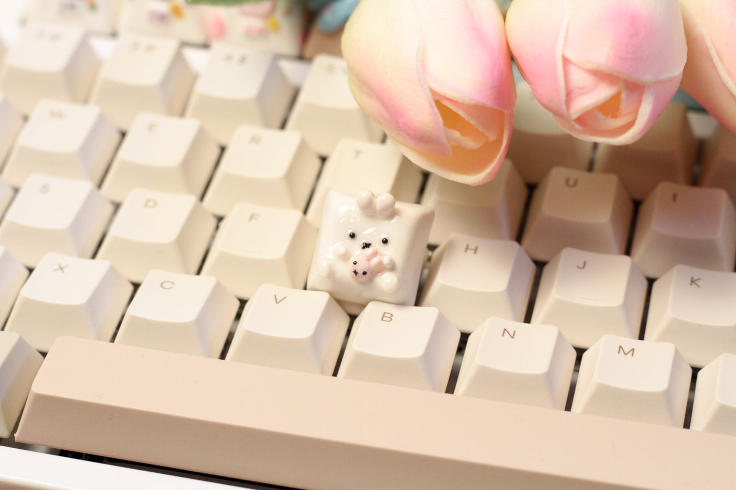 Miffy bunny holding a tiny doll version of miffy.