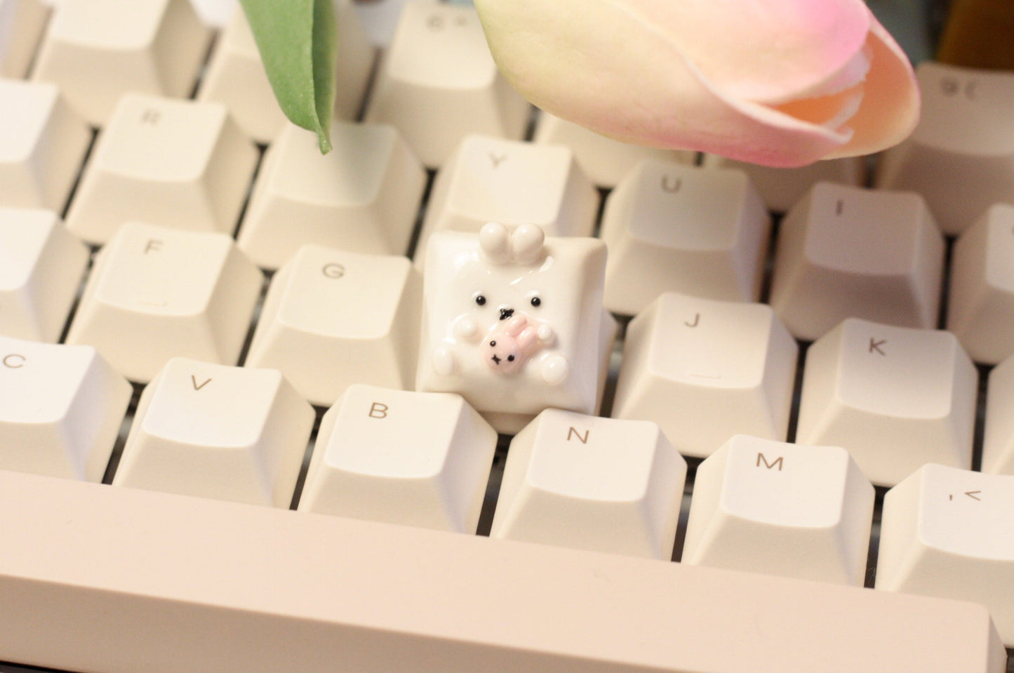 Miffy bunny holding a tiny doll version of miffy.