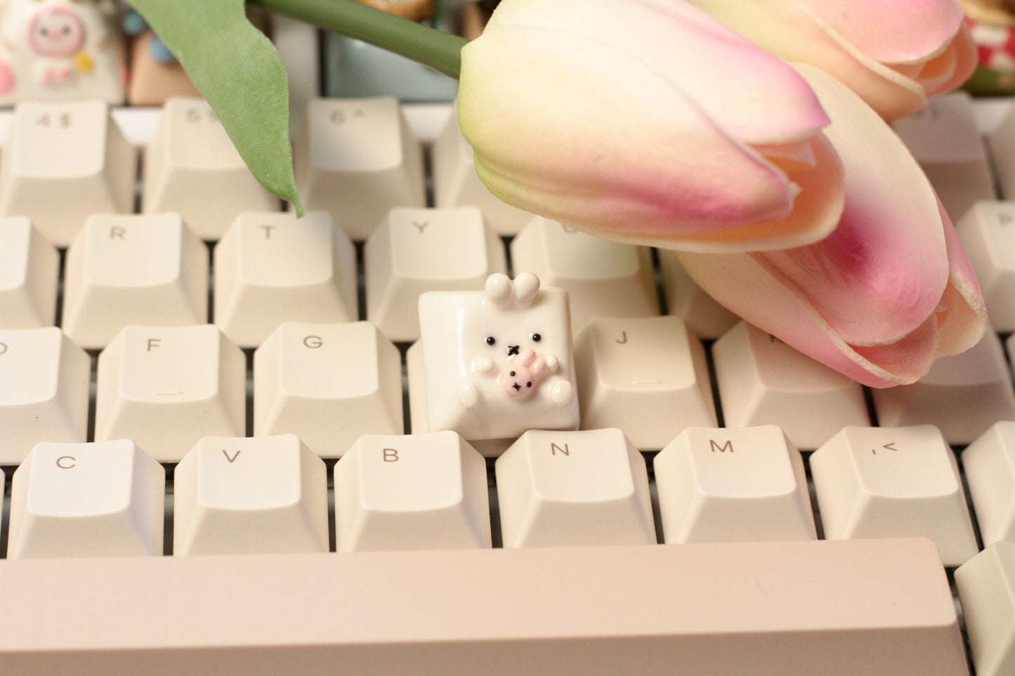 Miffy bunny holding a tiny doll version of miffy.