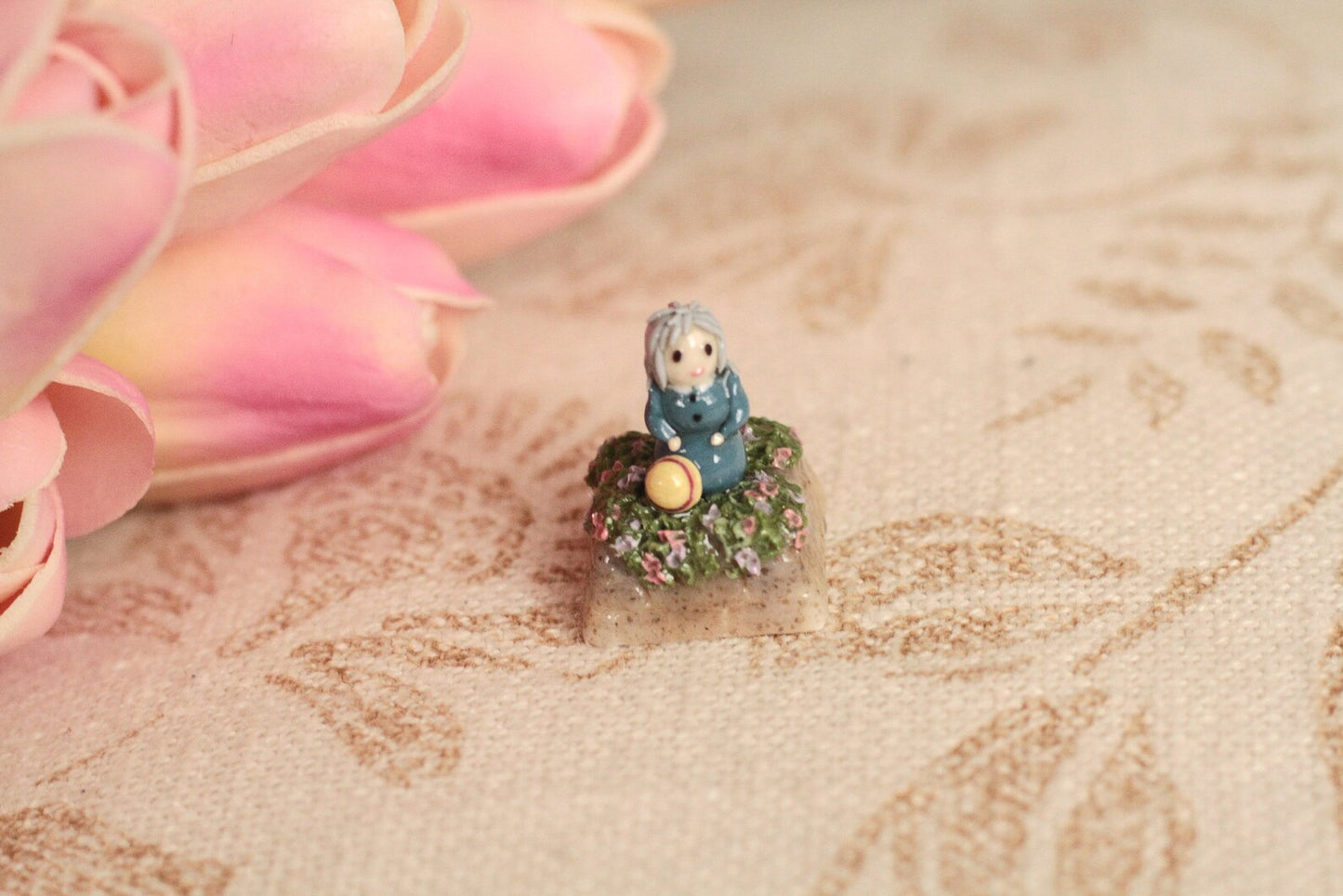 Howl's Moving Castle. Howl and Sophie with Cacifer in a flower meadow.