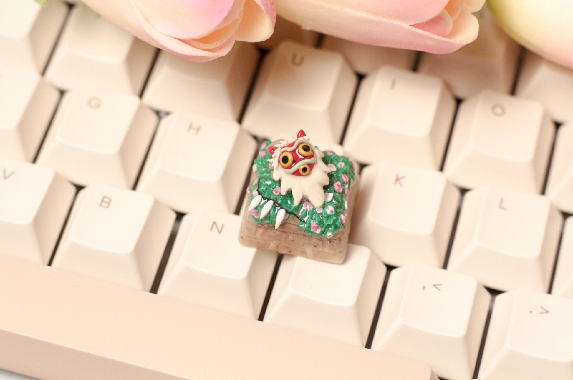 Princess Mononoke's mask and necklace on a flower meadow.