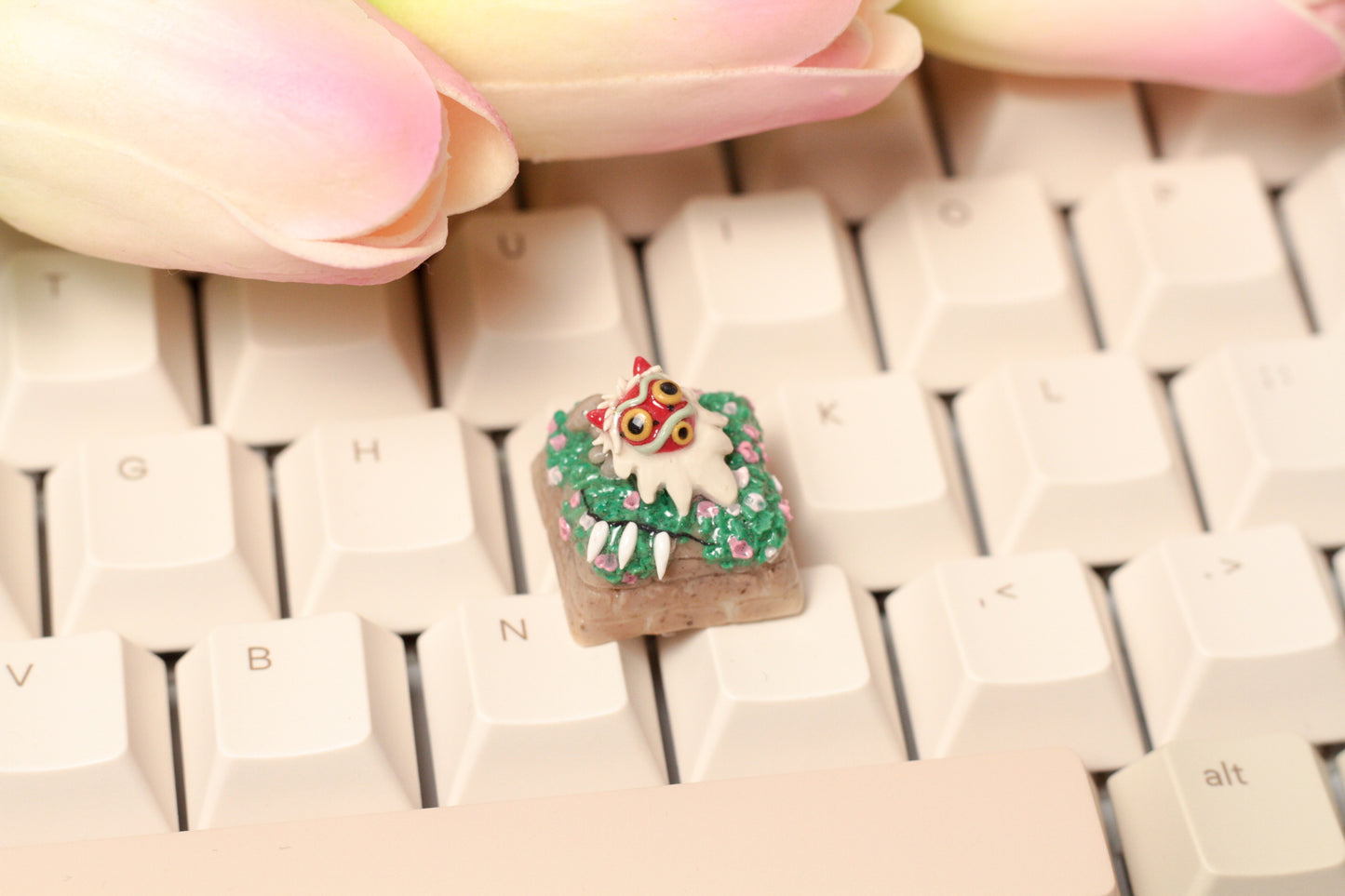 Princess Mononoke's mask and necklace on a flower meadow.